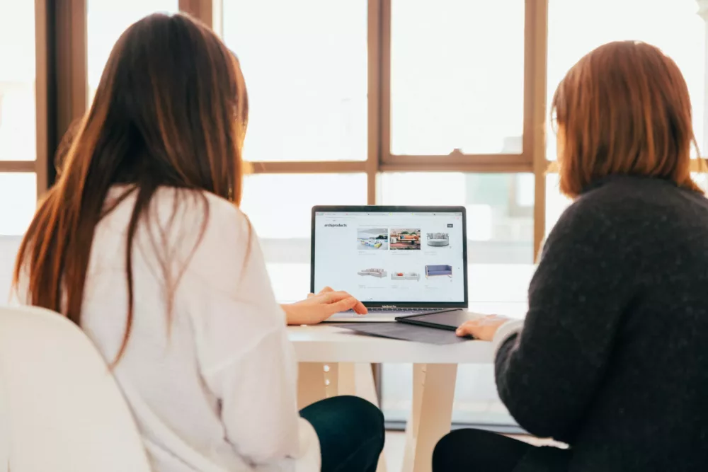 two women working together on digital marketing coaching and consulting