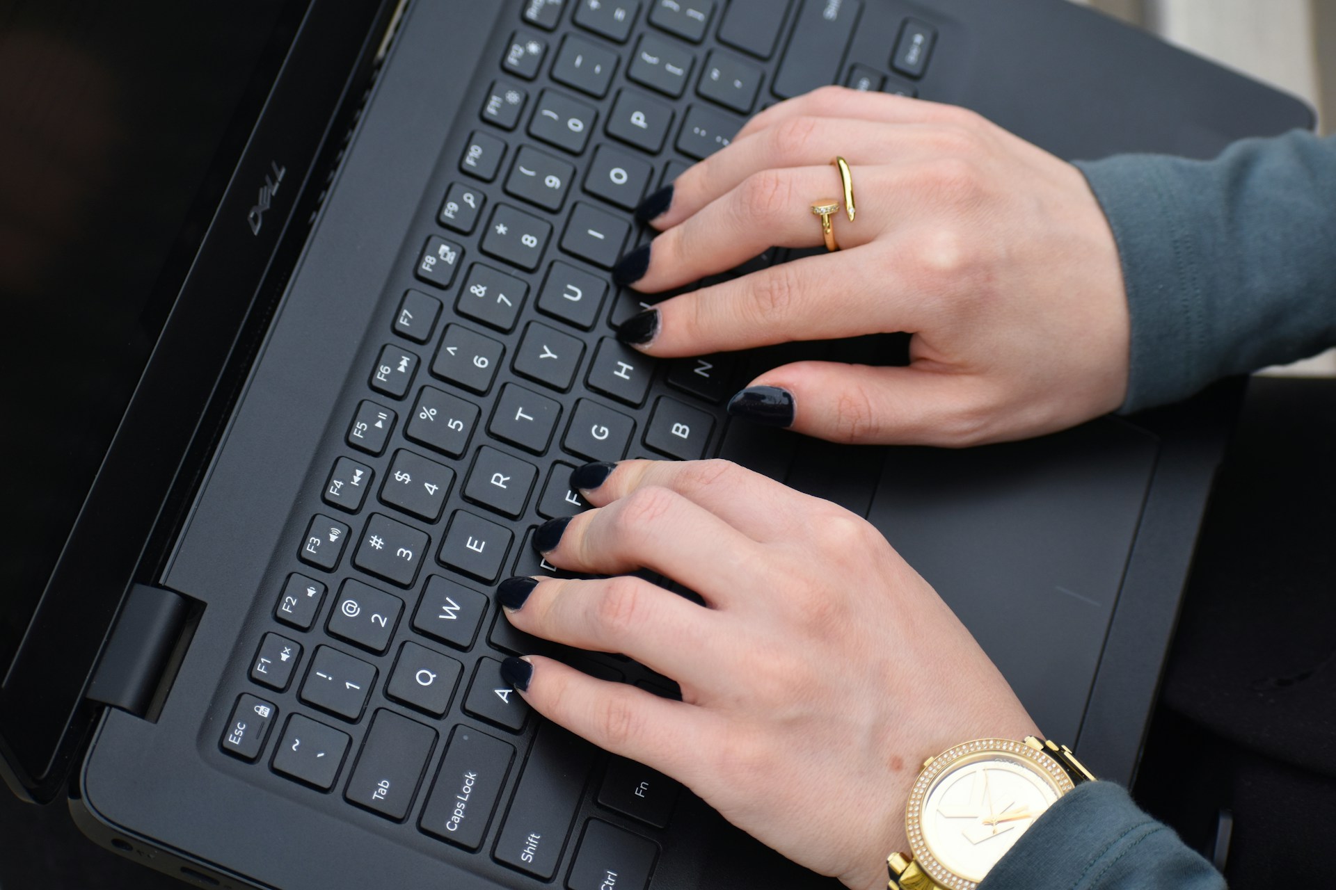 a person typing on a laptop